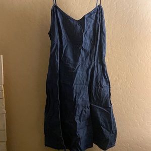 Jean material. Medium, blue, in good condition barley worn.